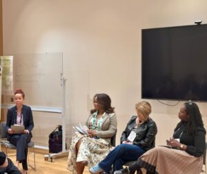 Four women in a panel presentation